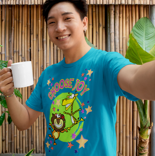 Model wearing Choose Joy T-shirt styled casually, smiling while holding a coffee mug in a relaxed setting