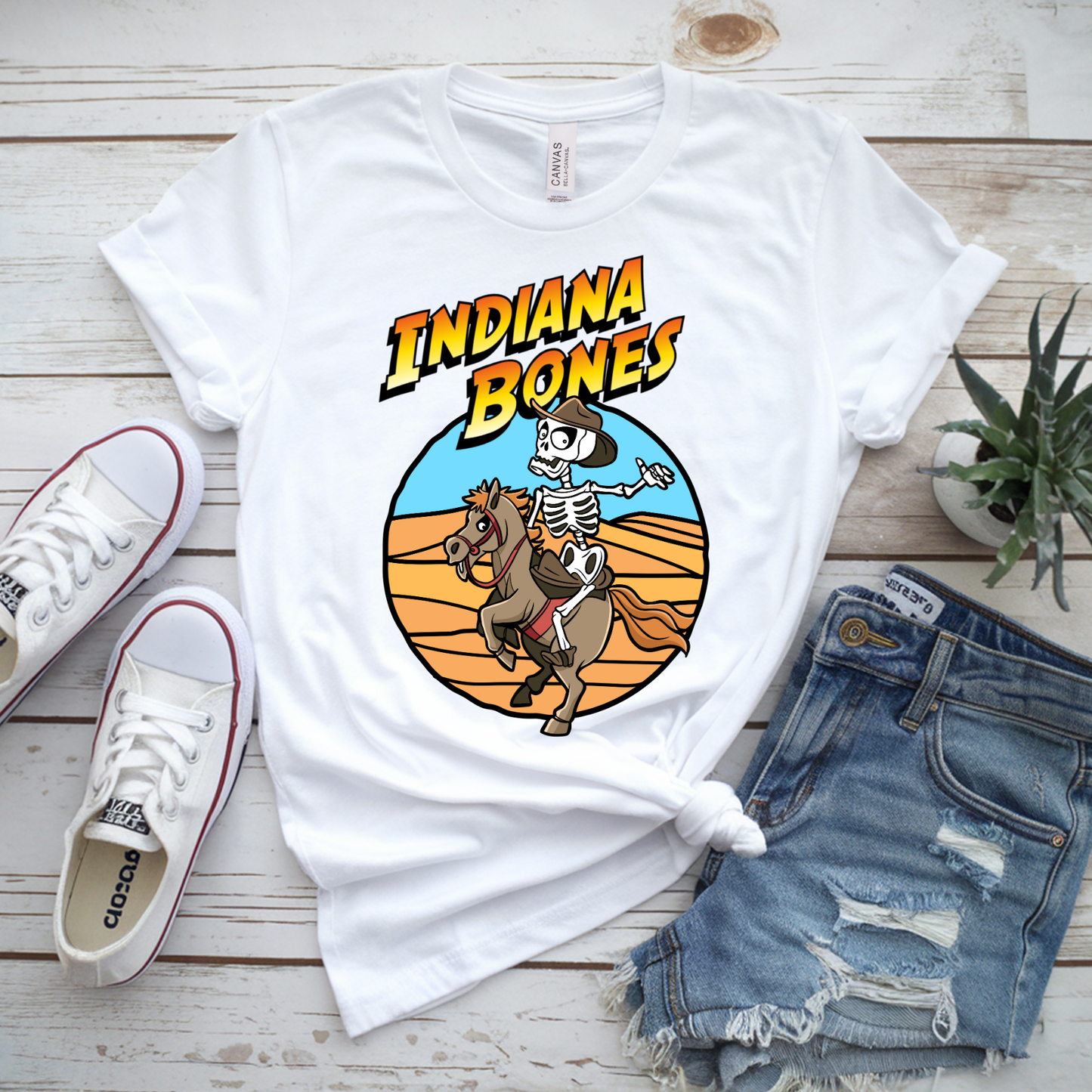 Indiana Bones Halloween T-Shirt – Funny Skeleton Cowboy Tee, Unisex Bella Canvas 3001, Spooky Movie Parody Shirt XS–5XL