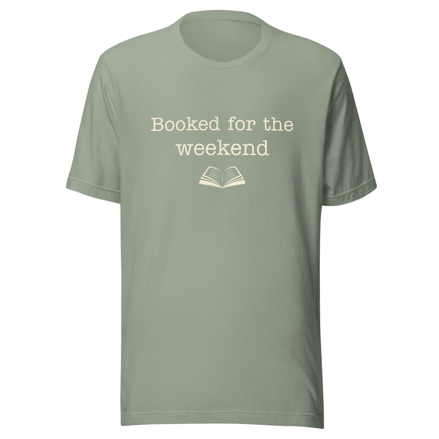 Sage “Booked for the Weekend” T-shirt with warm cream text and a small open book illustration.