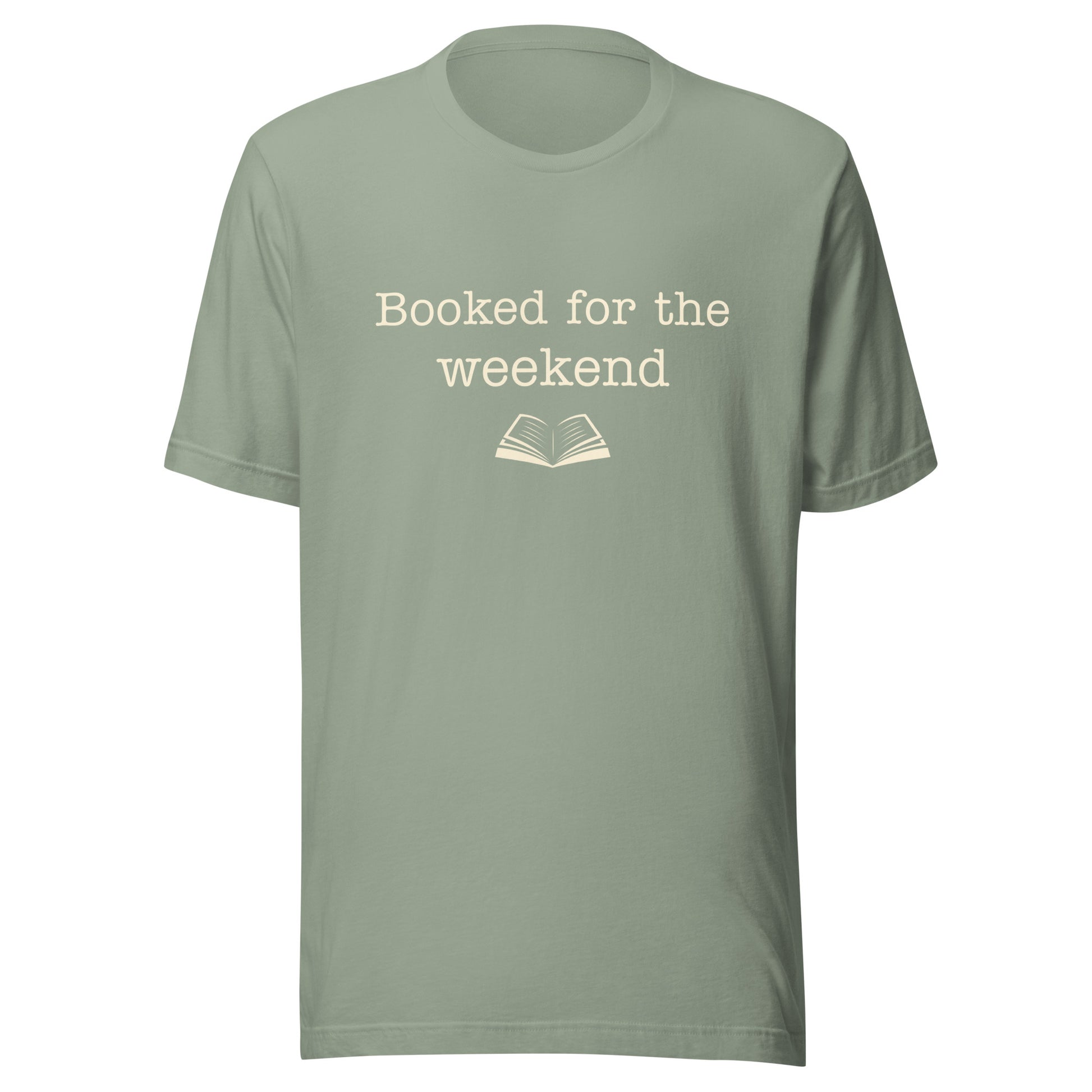 Sage “Booked for the Weekend” T-shirt with warm cream text and a small open book illustration.
