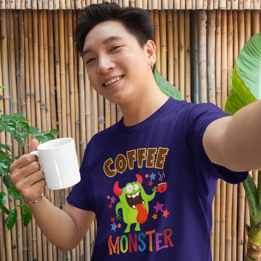 Coffee Monster graphic T-shirt worn by model holding a coffee mug, playful coffee lover tee for everyday comfort