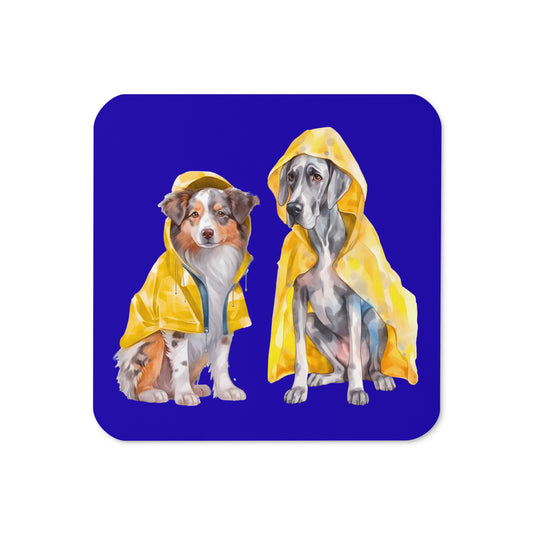 Rain Dogs cork-back coaster featuring two dogs in yellow raincoats on a blue background