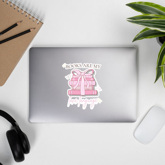 Books Are My Love Language pastel book sticker applied to laptop lid in soft desk setting 