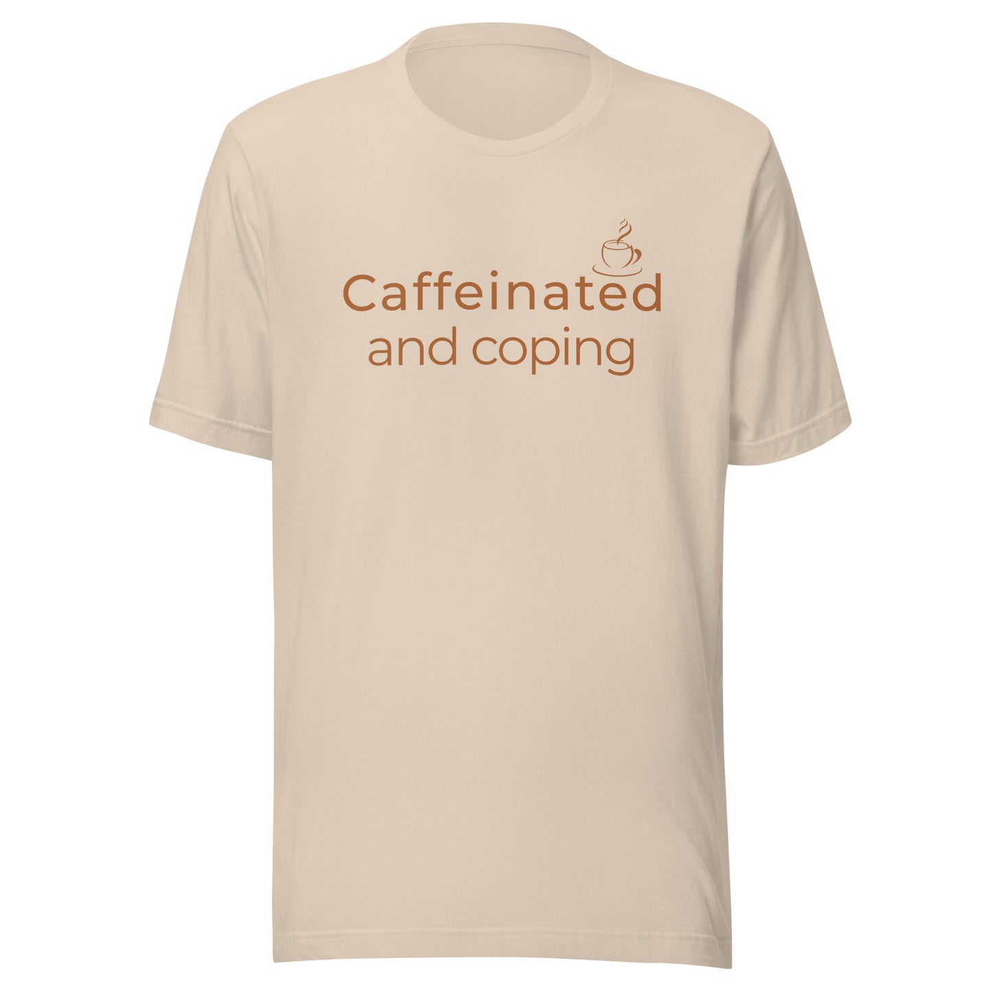 Natural T-shirt with warm brown “Caffeinated and Coping” coffee lover graphic on the front.