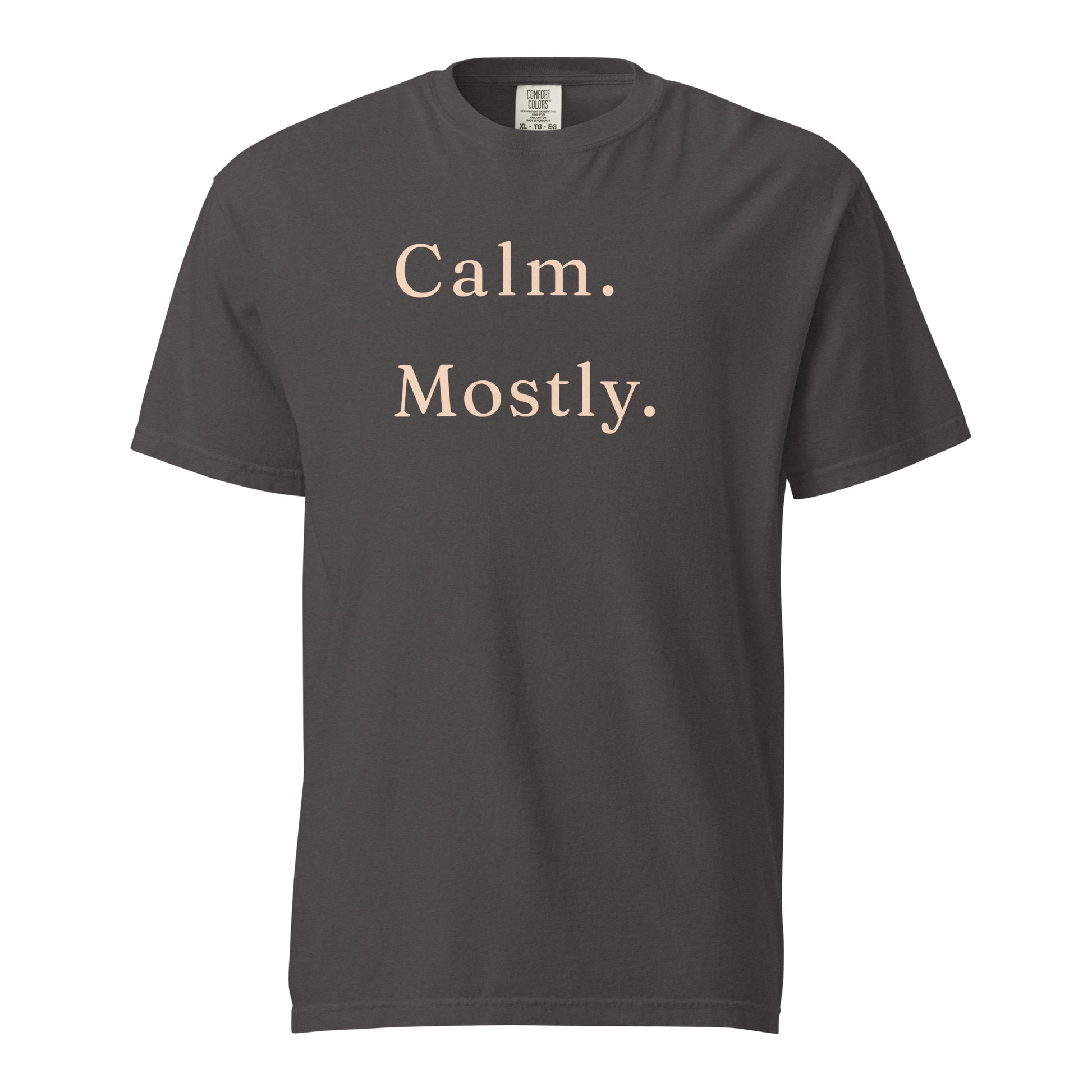 Graphite Comfort Colors T-shirt with “Calm. Mostly.” printed in cream serif lettering on the front.