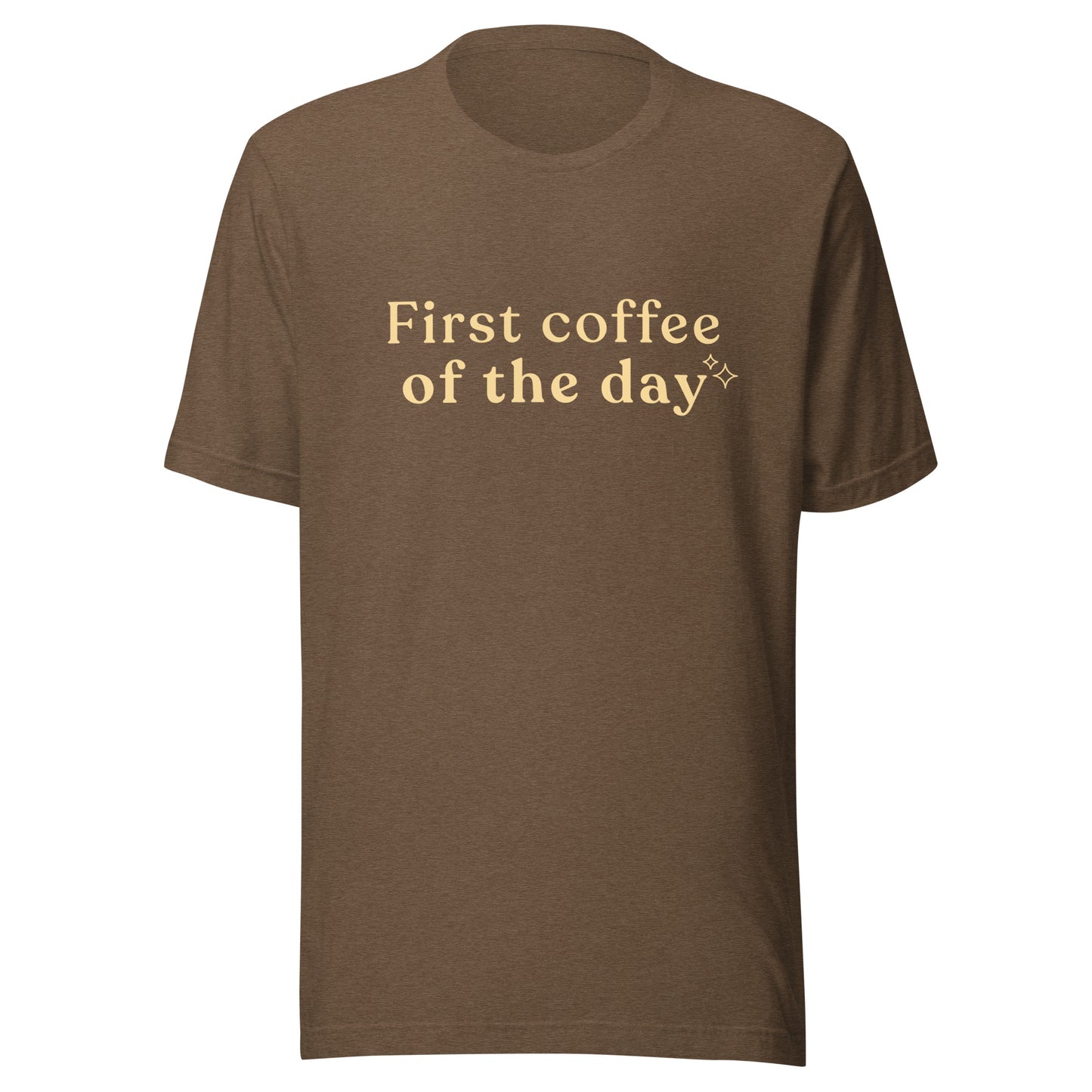 Brown First Coffee of the Day T-shirt flat lay showing warm ivory text and small sparkle detail.