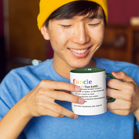Smiling person holding Funcle ceramic mug with coloured interior