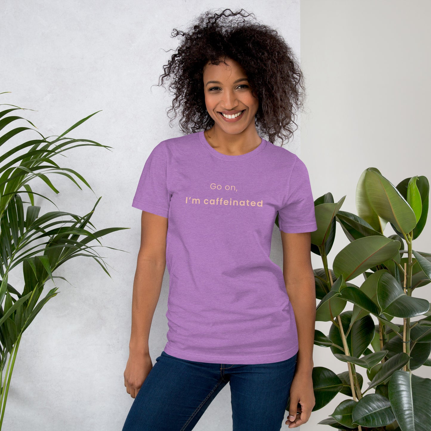 Woman wearing purple coffee lover graphic tee