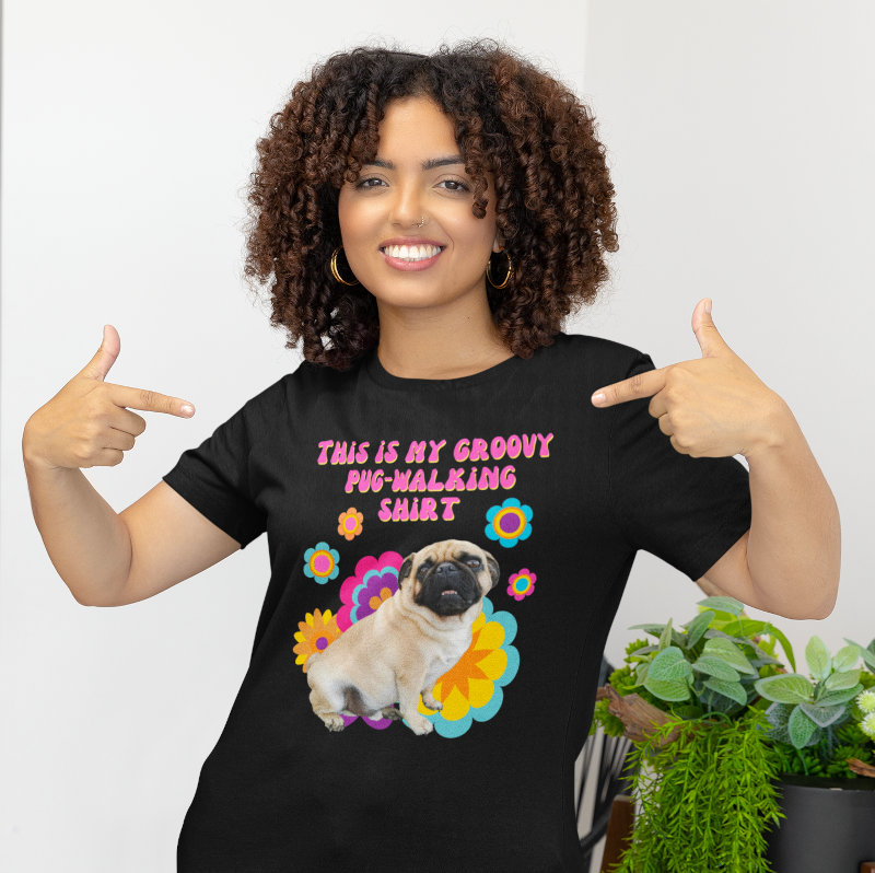 Model wearing groovy pug-walking T-shirt styled for casual everyday wear