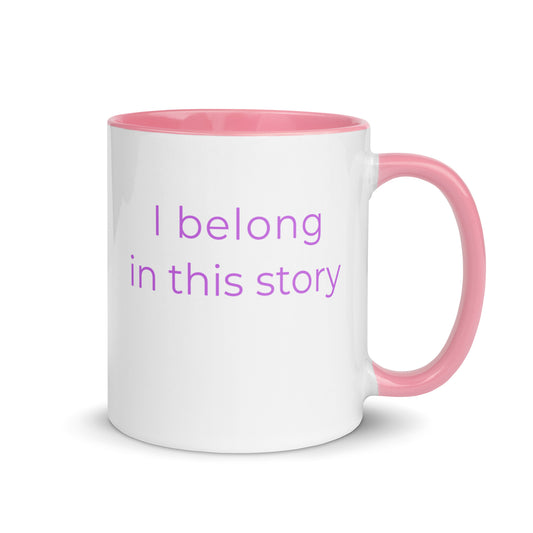 Minimalist ceramic coffee mug with pink handle and the phrase “I belong in this story”, designed for book lovers and thoughtful reading moments.