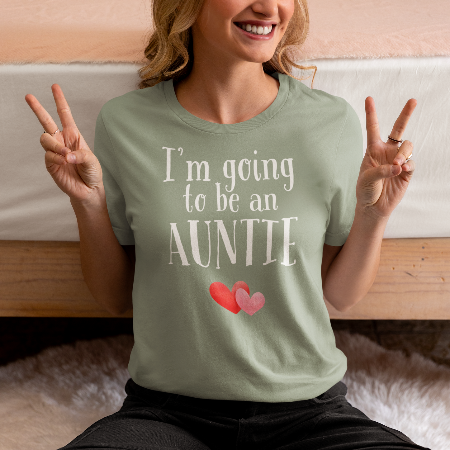 Lifestyle photo of woman wearing I’m going to be an auntie t-shirt