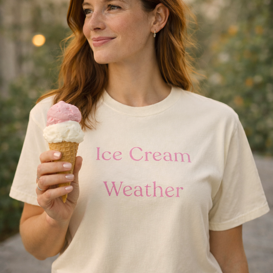 Ice Cream Weather Comfort Colors T-shirt worn by woman holding strawberry and vanilla ice cream cone in warm outdoor setting