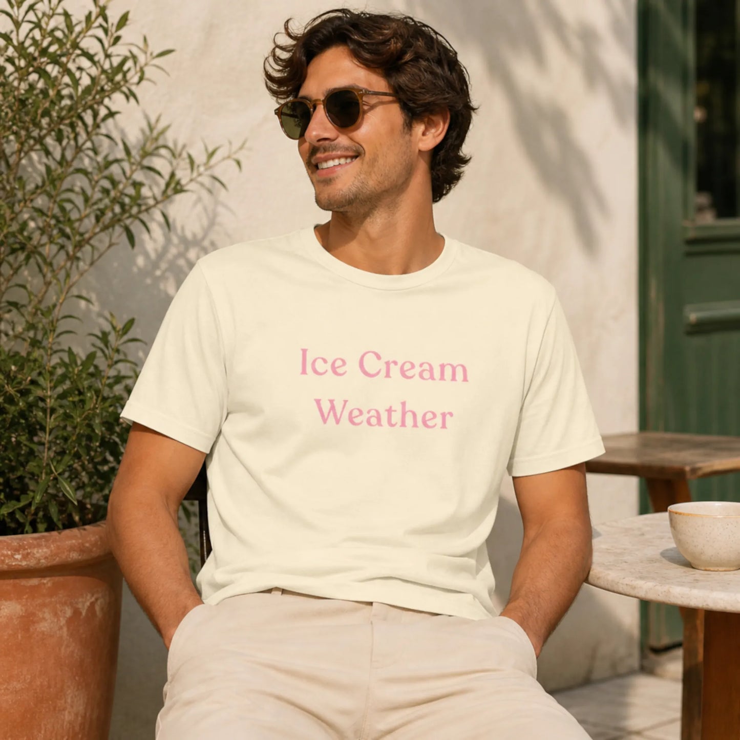 Male model wearing the Ice Cream Weather T-Shirt in natural, styled casually outdoors in warm sunshine.