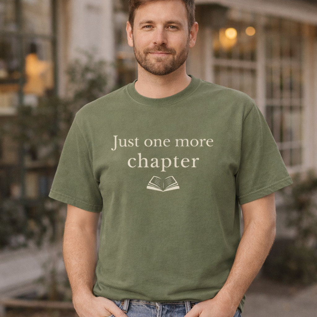 Male model wearing Moss Comfort Colors Just one more chapter reader T-shirt outdoors
