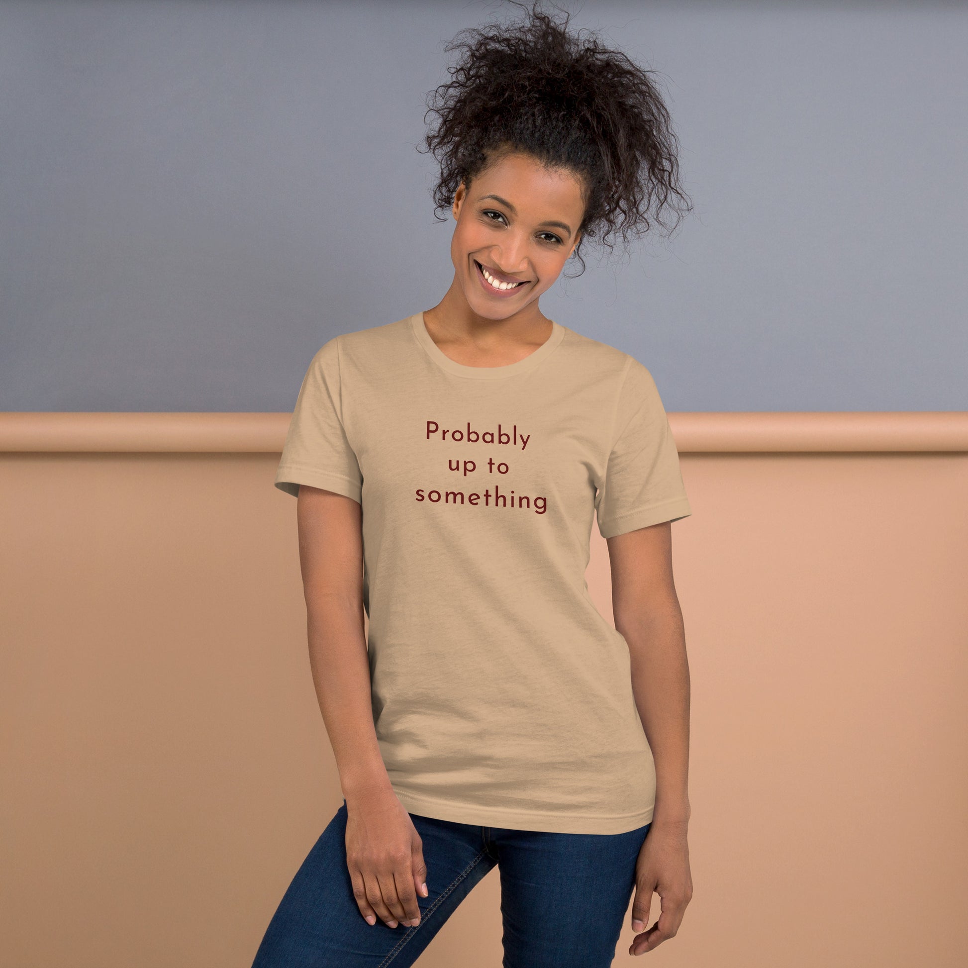Woman wearing tan Probably Up To Something T-shirt styled casually with relaxed unisex fit