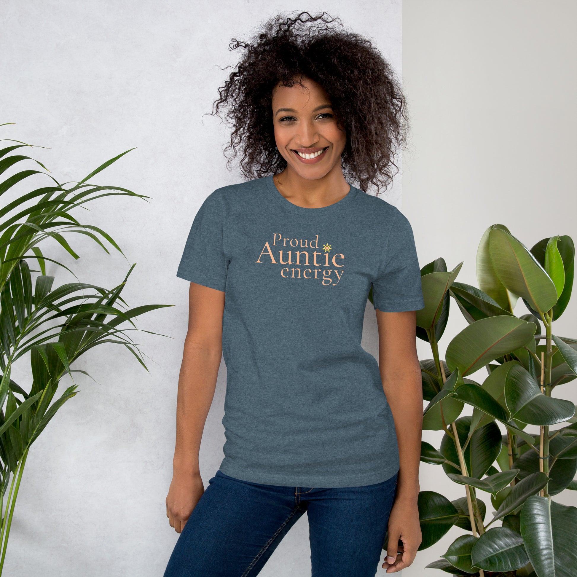 Woman wearing Proud Auntie Energy heather slate T-shirt in relaxed everyday setting