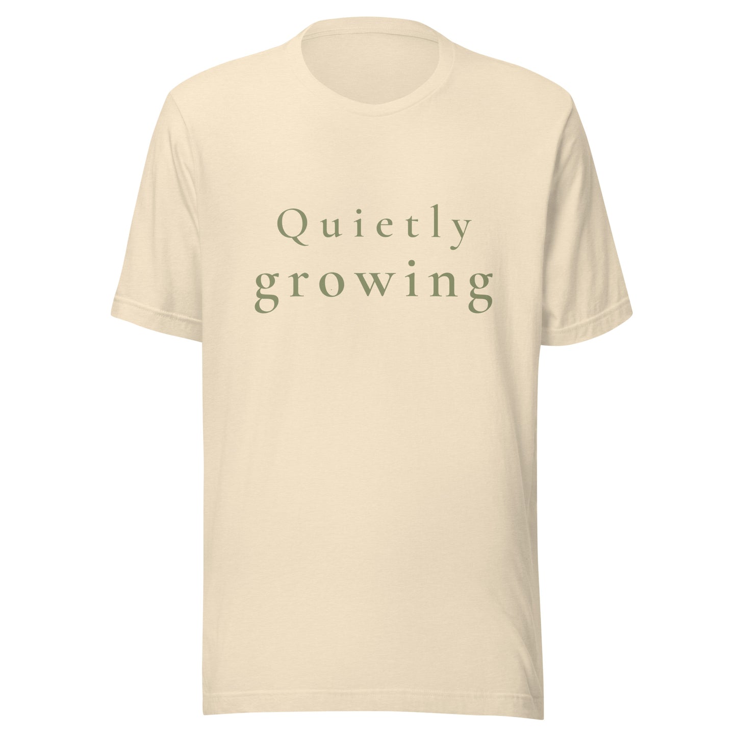 Heather Natural Quietly Growing T-shirt product mockup with soft sage text.