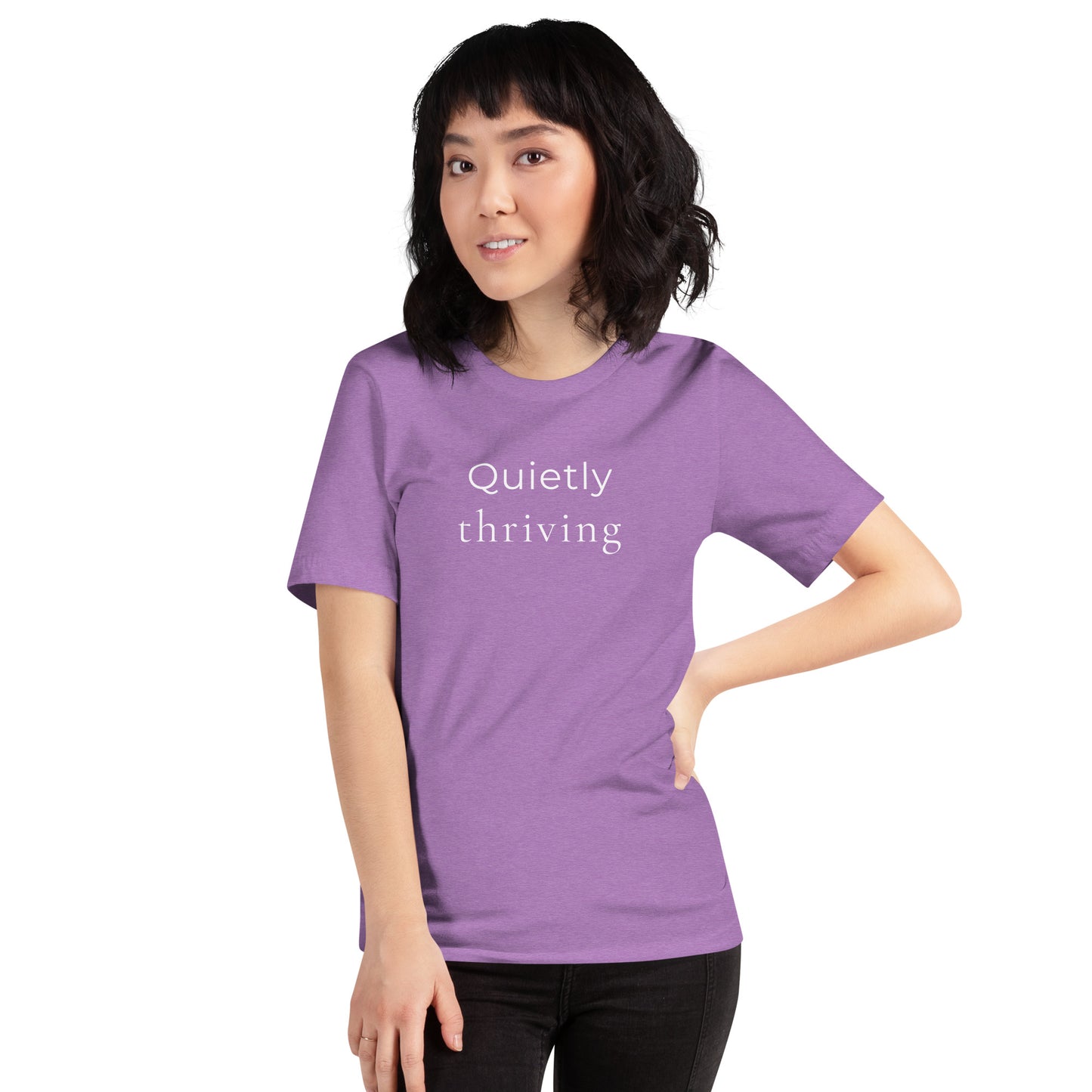 Woman wearing heather purple “Quietly Thriving” T-shirt styled casually with relaxed everyday fit