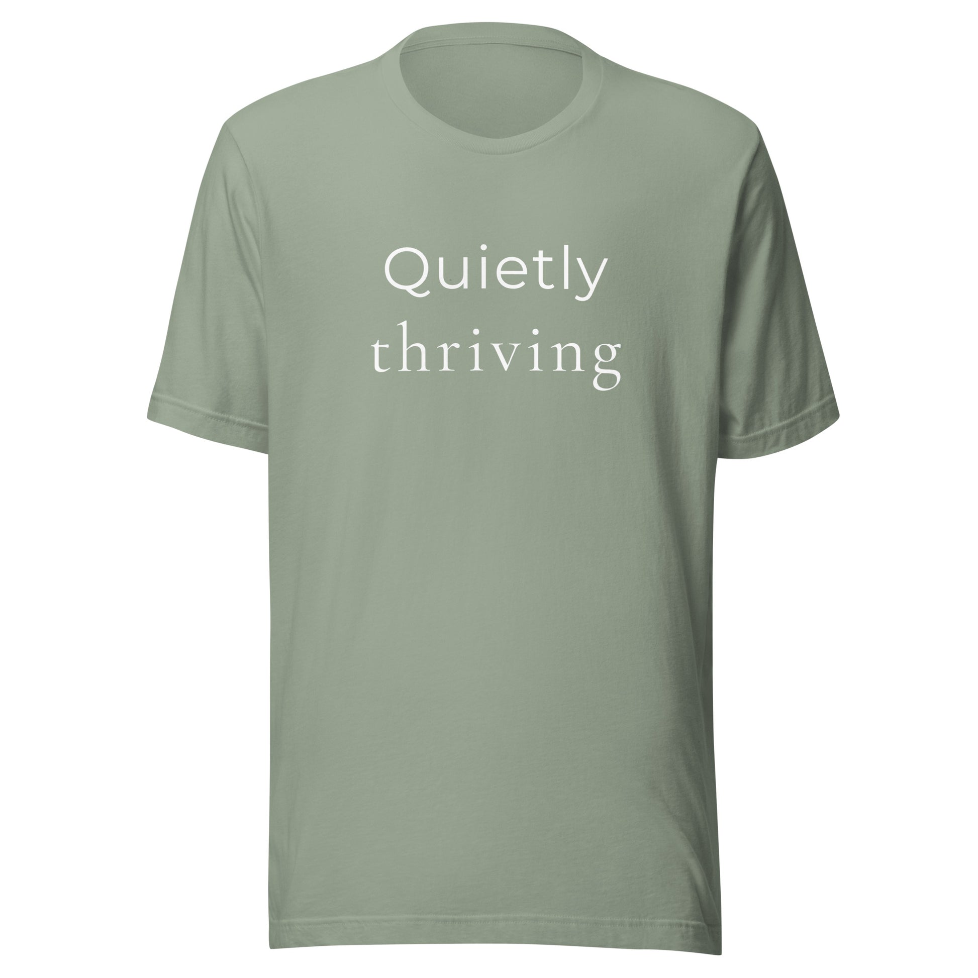 “Quietly Thriving” minimalist graphic T-shirt in sage green on soft unisex Bella+Canvas tee