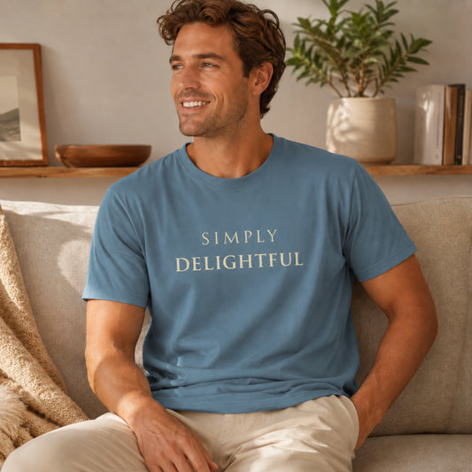 Male model wearing a Steel Blue Simply Delightful T-shirt in a warm, relaxed indoor lifestyle setting.
