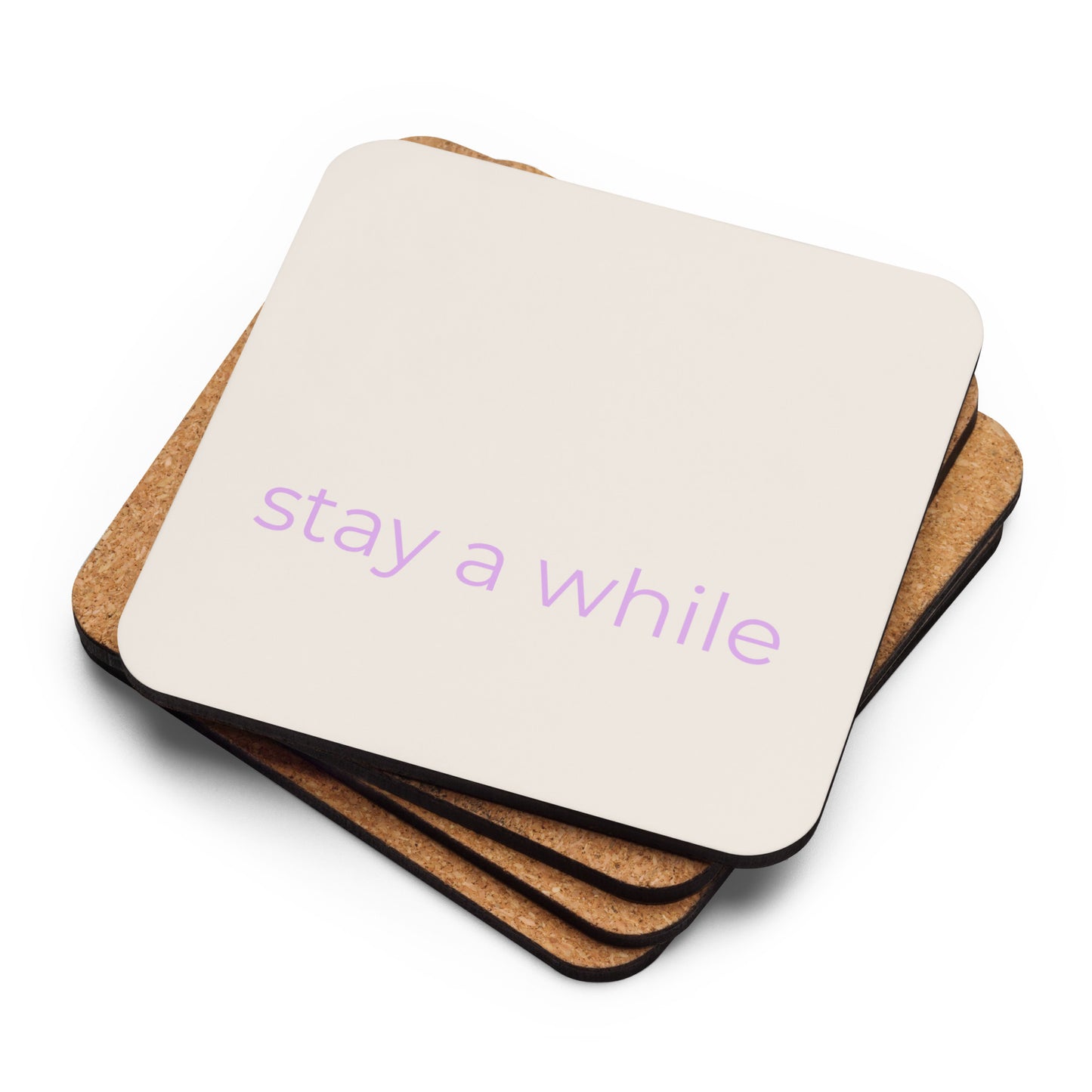Stack of neutral cork-back coasters with “stay a while” text in soft purple showing layered edges