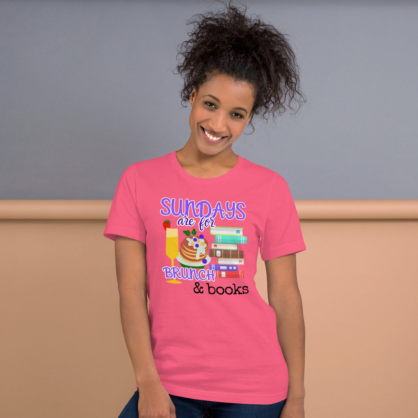 Person wearing pink brunch and books T-shirt, relaxed joyful living style