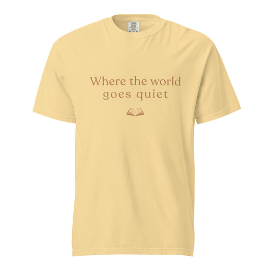 Butter yellow Comfort Colors T-shirt with “Where the world goes quiet” text and small book illustration, minimalist book lover design