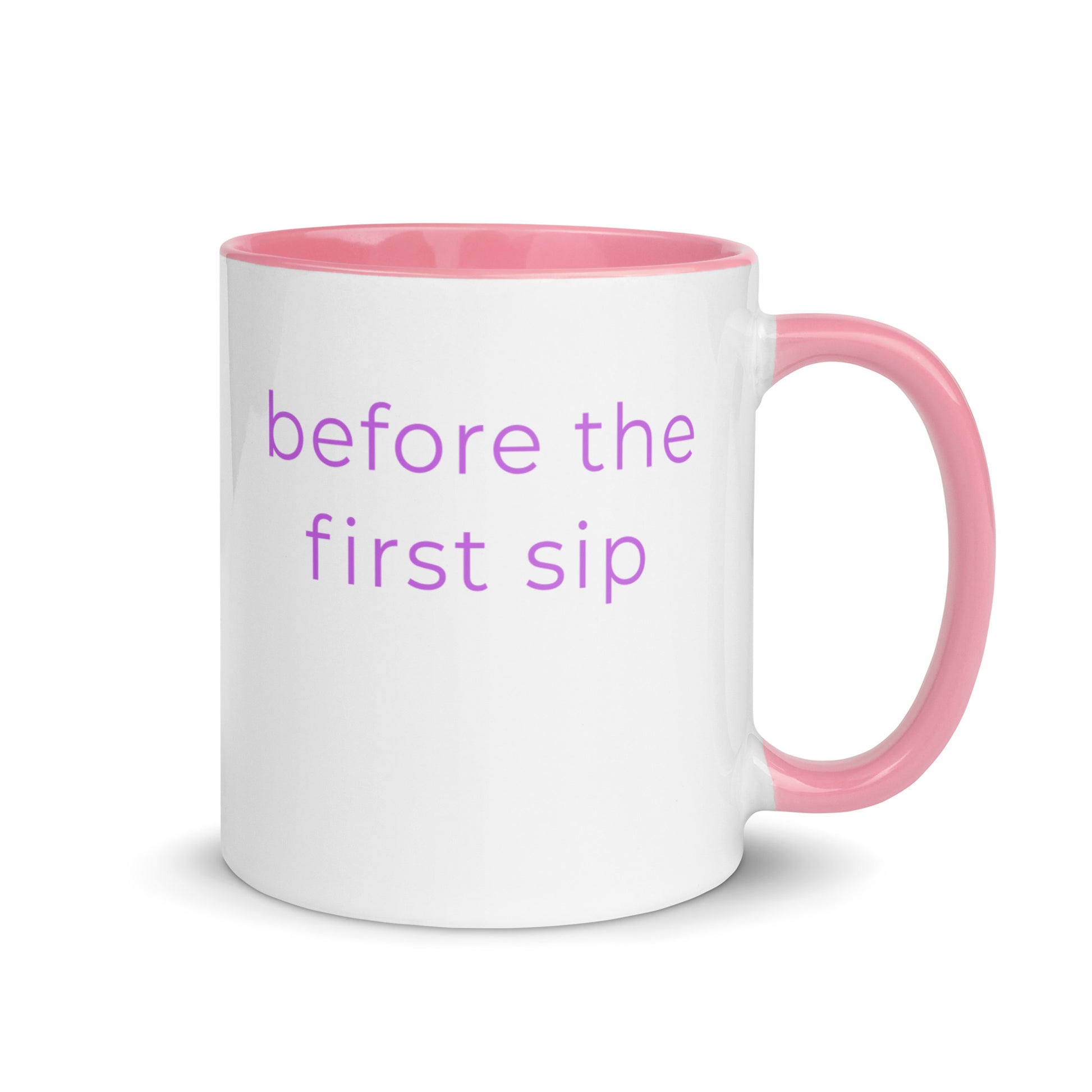Minimalist ceramic coffee mug with pink handle and the phrase “before the first sip”, designed for calm slow mornings and quiet everyday moments.