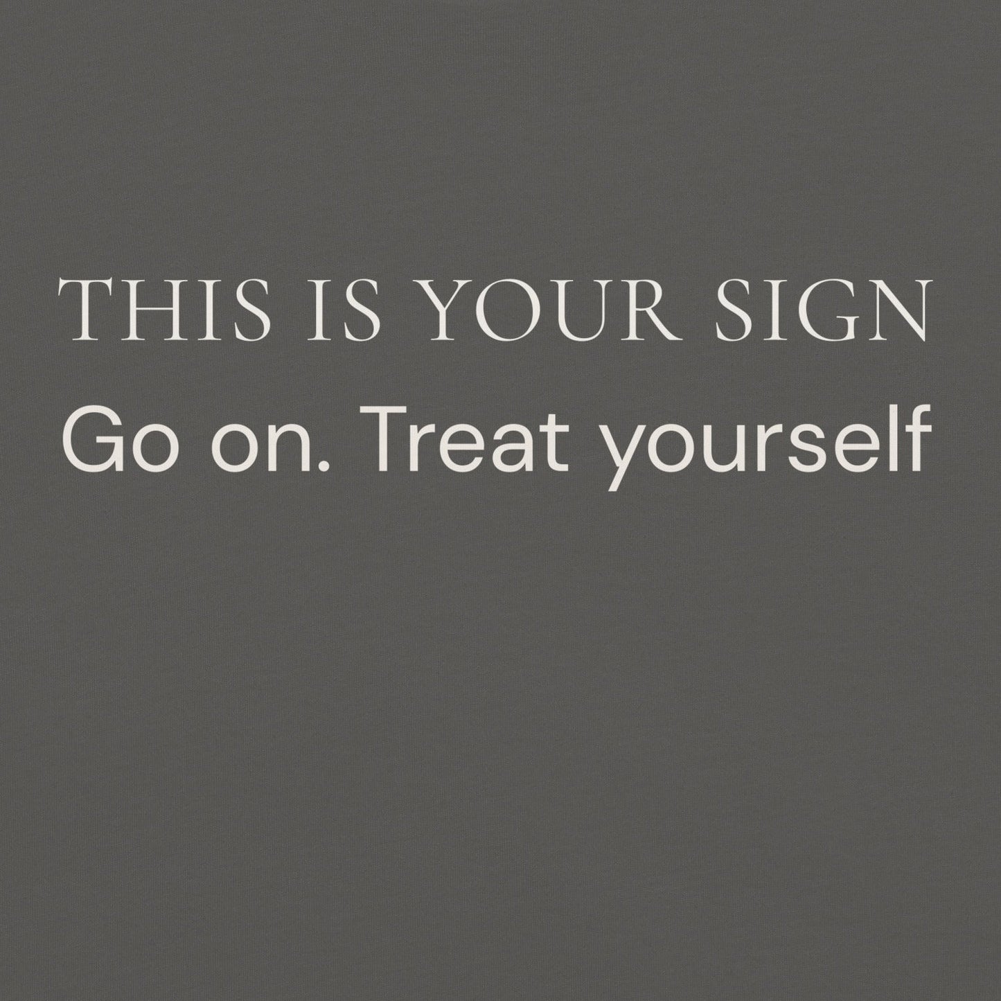 Close-up of “This Is Your Sign Go On Treat Yourself” text printed on Comfort Colors T-Shirt