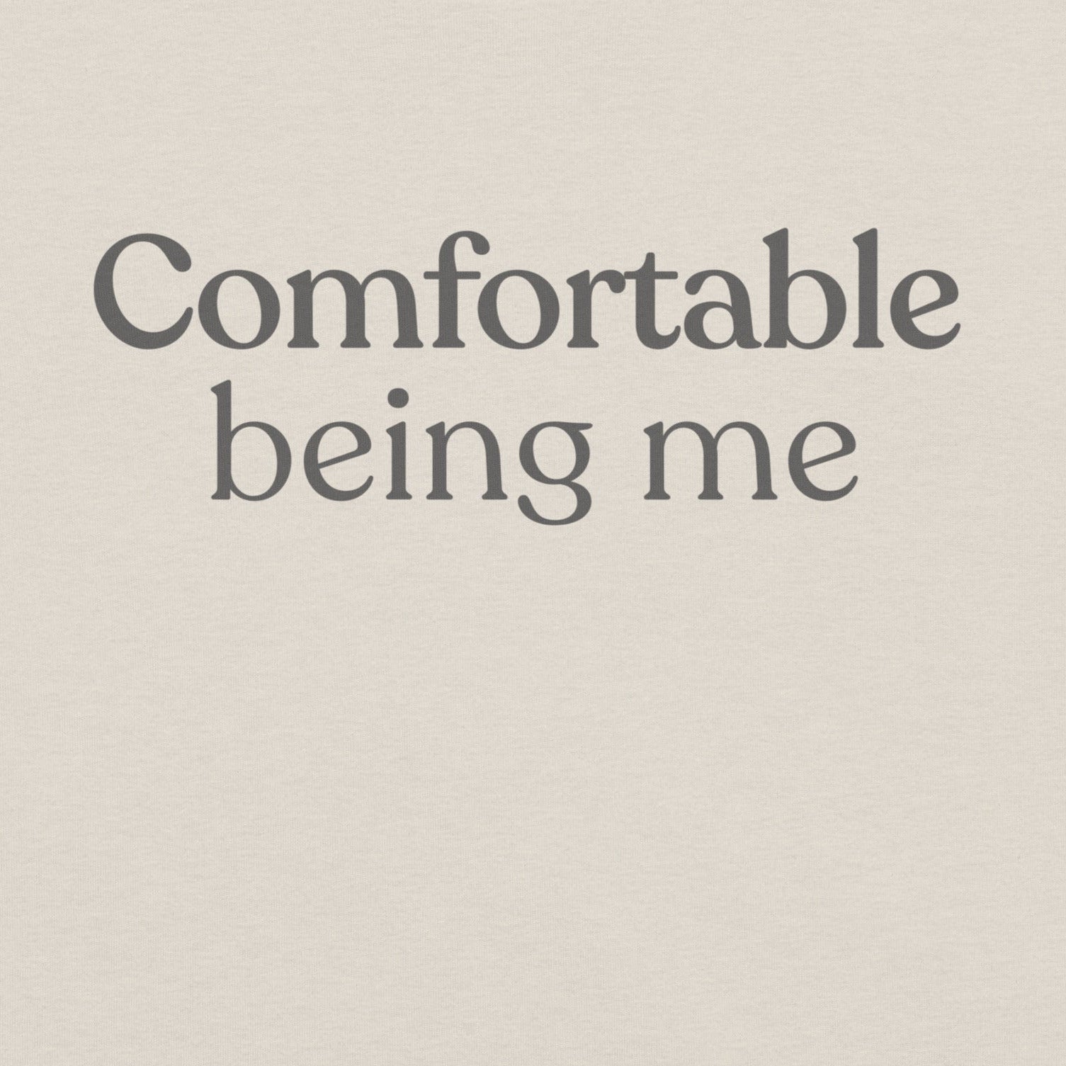 Close-up of Comfortable Being Me design on heather dust T-shirt