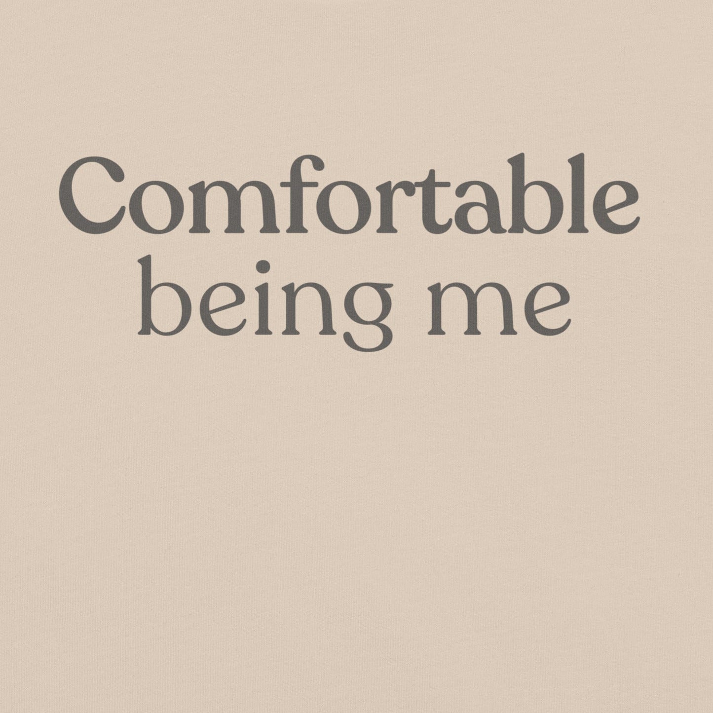 Close-up of Comfortable Being Me design on soft cream T-shirt