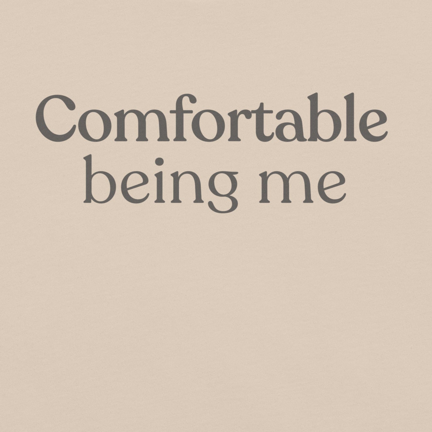 Close-up of Comfortable Being Me design on soft cream T-shirt
