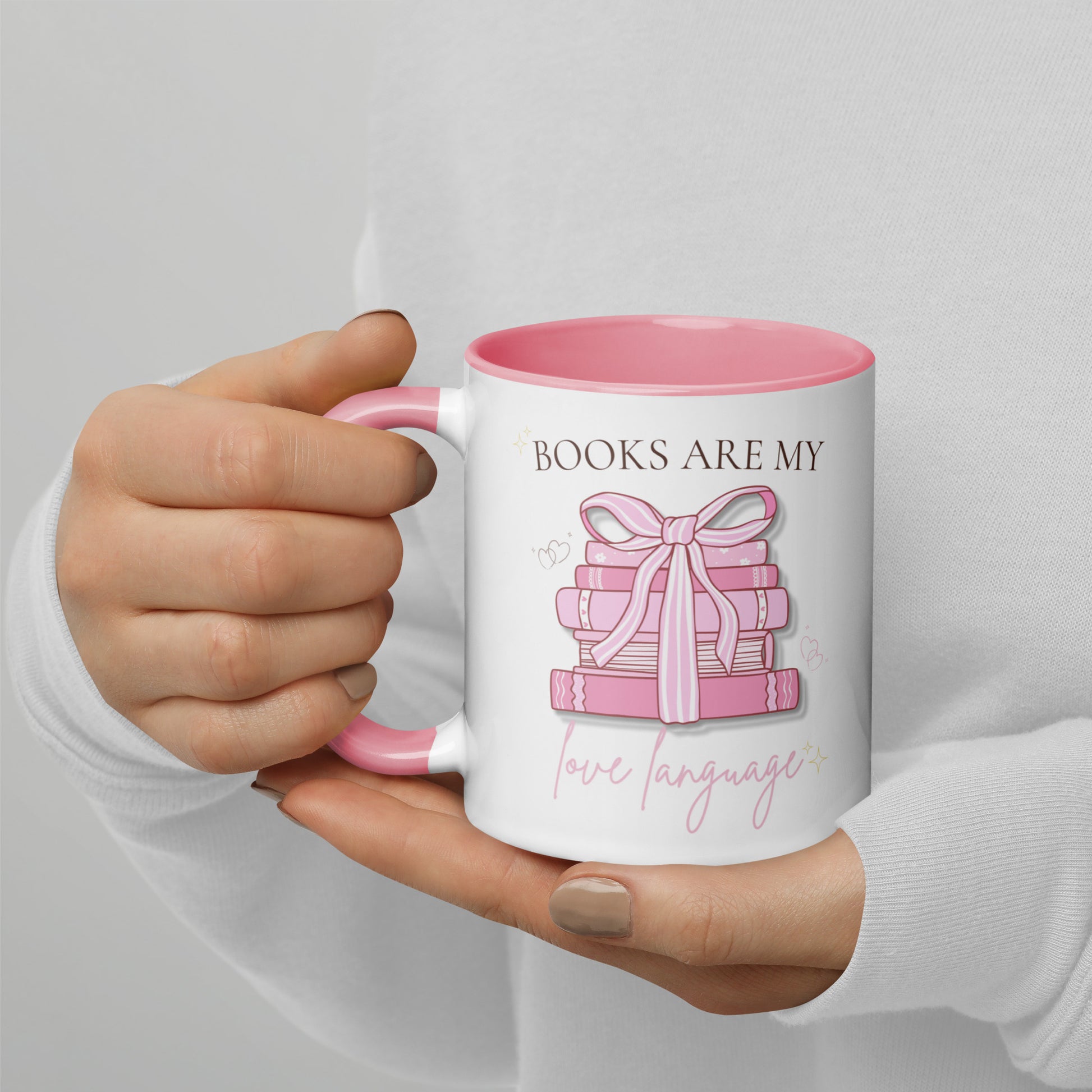 Pastel pink reading mug with ribbon-tied book stack